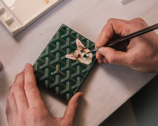 Hand-painted pet portrait and initials on green Goyard wallet personalised by Aivis Provejs for birthday gift