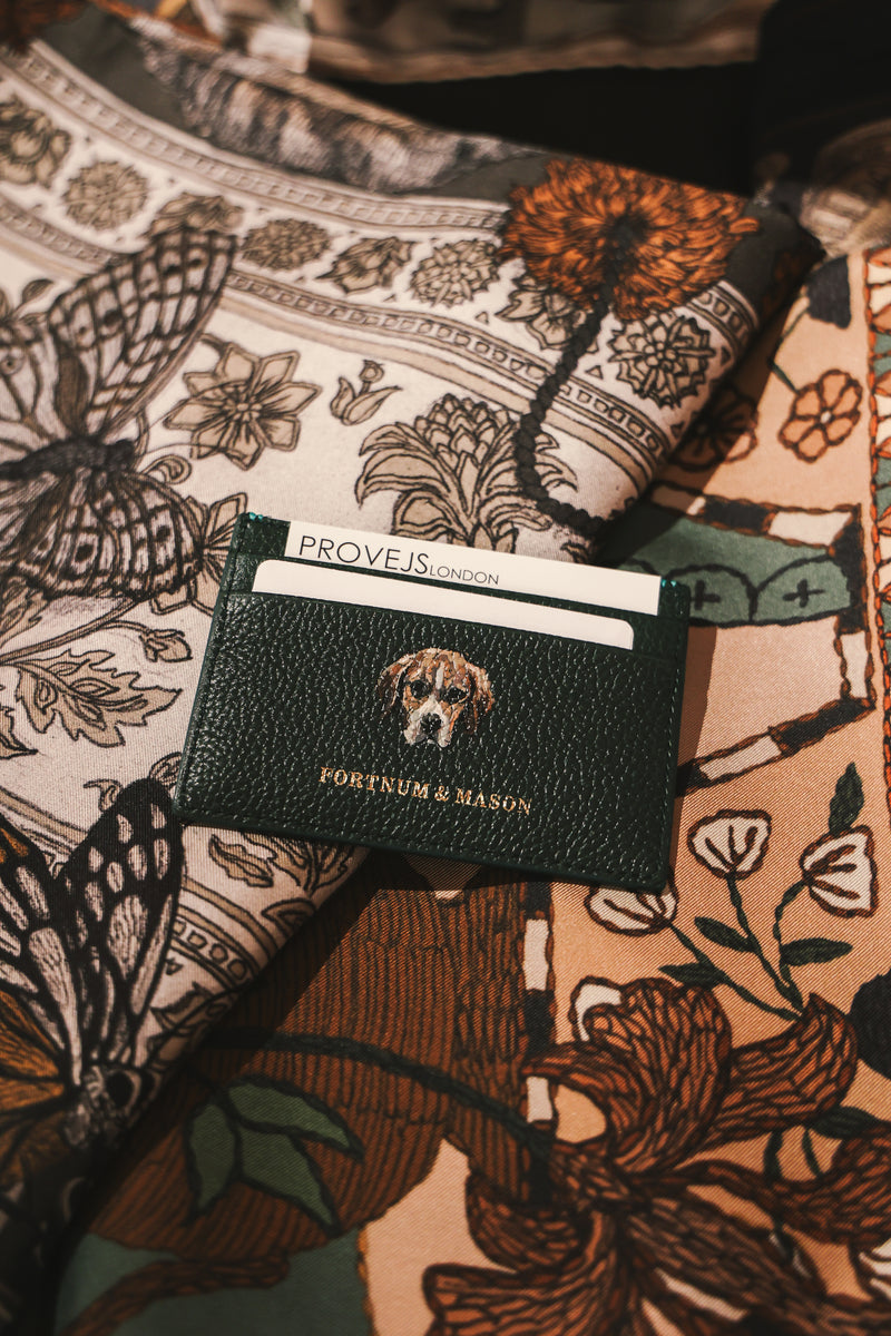 Fortnum & Mason leather card holder featuring a hand-painted dog portrait, showcasing bespoke luxury leather personalisation and custom pet artwork by Aivis Provejs.