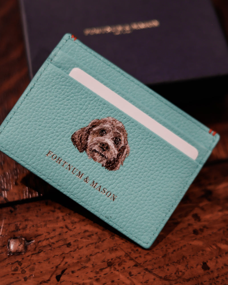 Fortnum & Mason leather card holder featuring a hand-painted pet portrait, showcasing bespoke luxury leather personalisation by Aivis Provejs.