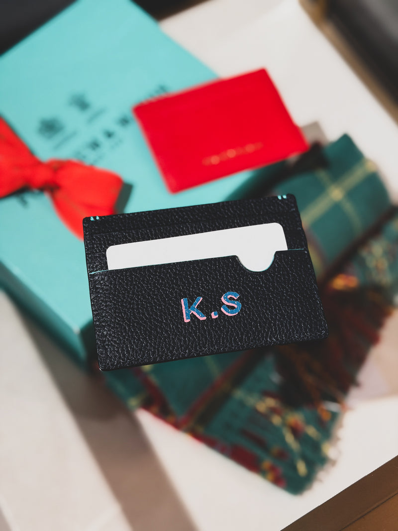 Personalised Fortnum & Mason leather card holder with hand-painted initials by Aivis Provejs, bespoke luxury leather gifting and personalisation.