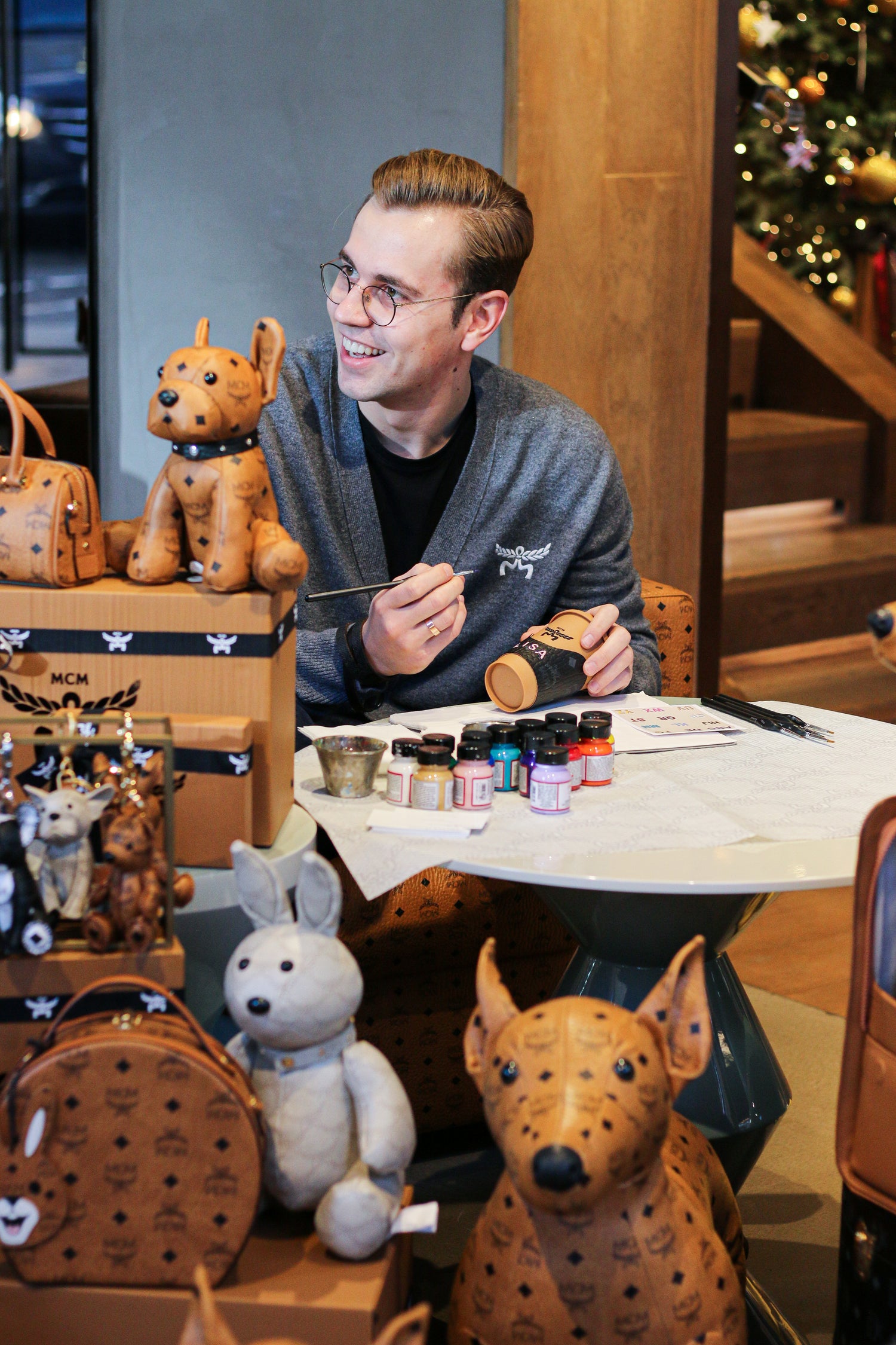 London artist Aivis Provejs creating bespoke leather personalisation for a luxury brand event